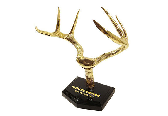 gold plated deer antlers as a trophy sculpture made to hang on a wall